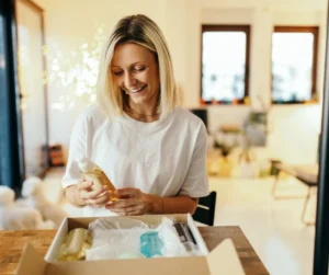 woman opening subscription delivery