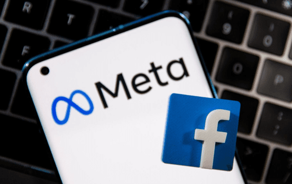 Phone displaying new Meta logo and Facebook logo