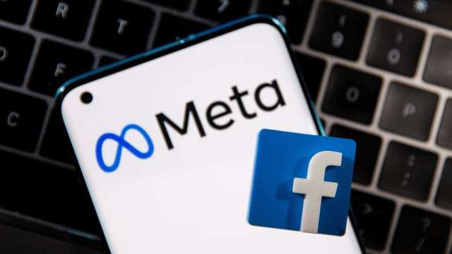 Phone displaying new Meta logo and Facebook logo