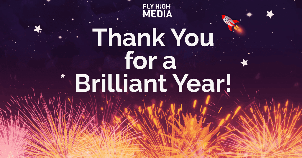 Fireworks display beneath a space sky which contain stars and one rocketship, and the text 'thank you for a brilliant year' in the top centre with the fly high media logo above it