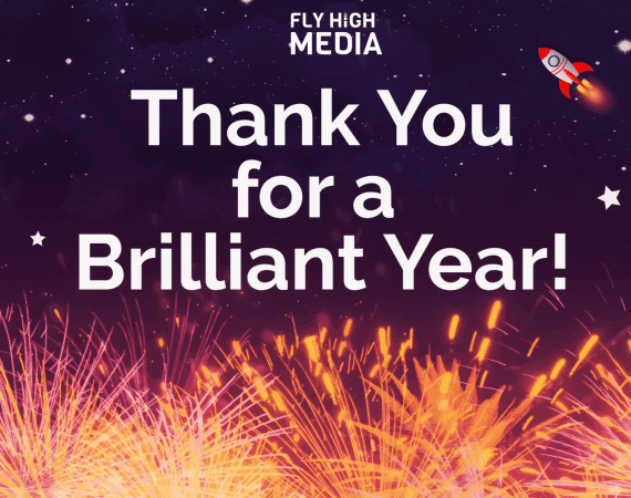 Fireworks display beneath a space sky which contain stars and one rocketship, and the text 'thank you for a brilliant year' in the top centre with the fly high media logo above it