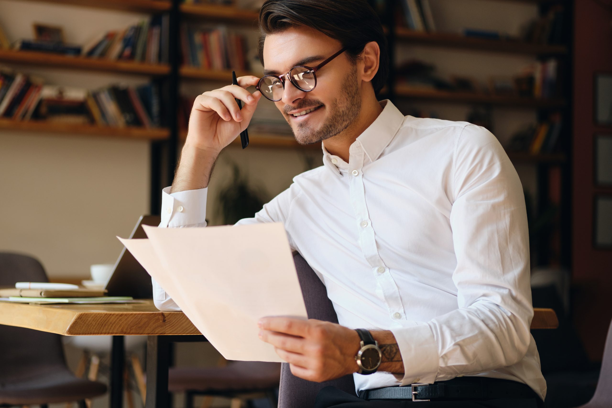 Man reading documents at a desk