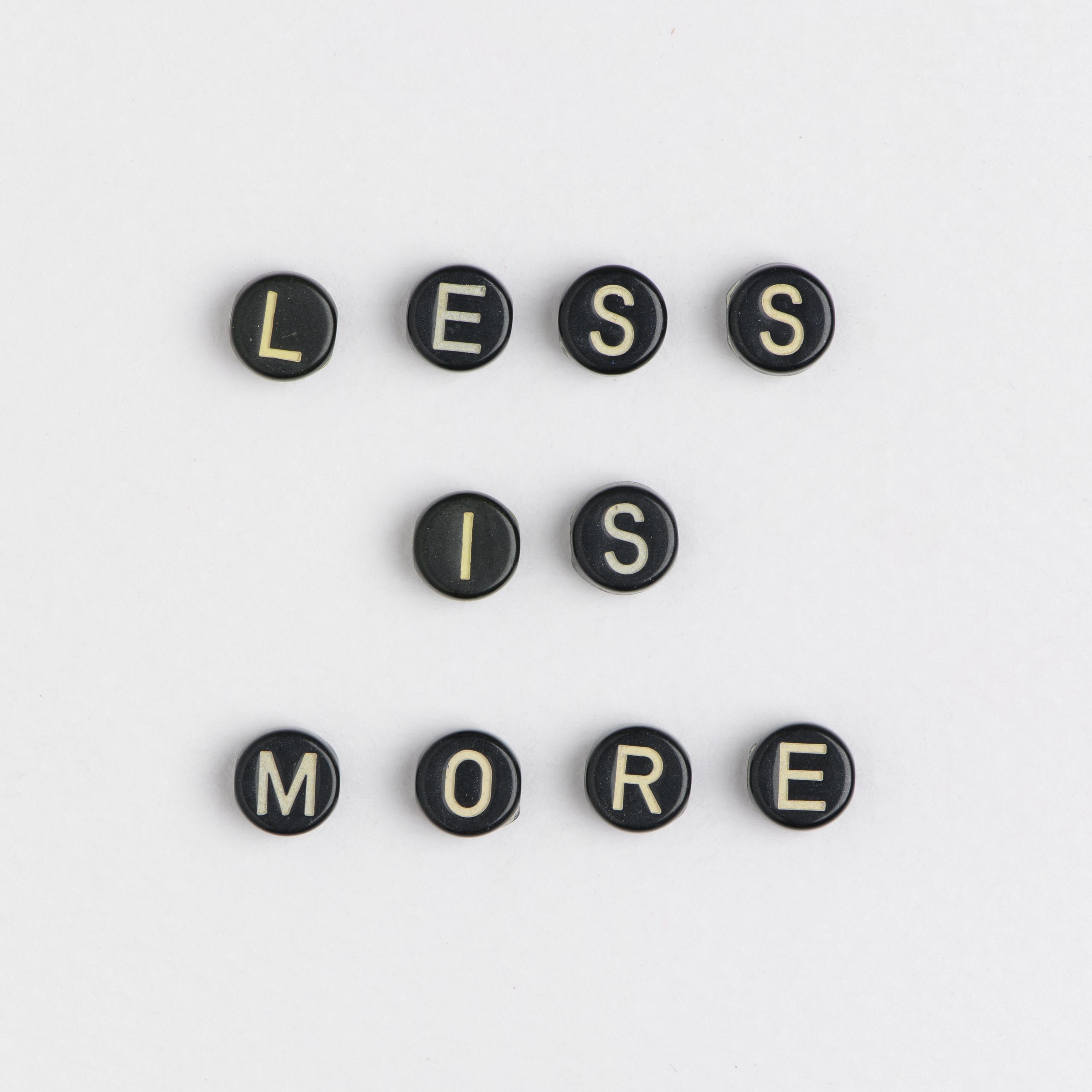 Beads spelling 'less is more'