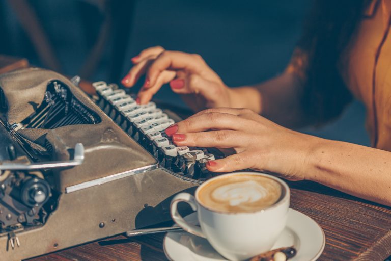 woman sitting and writing something