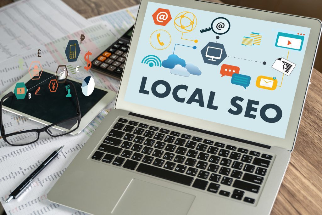Local SEO graphic with laptop and icons