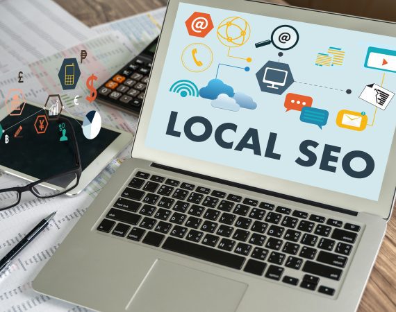 Local SEO graphic with laptop and icons