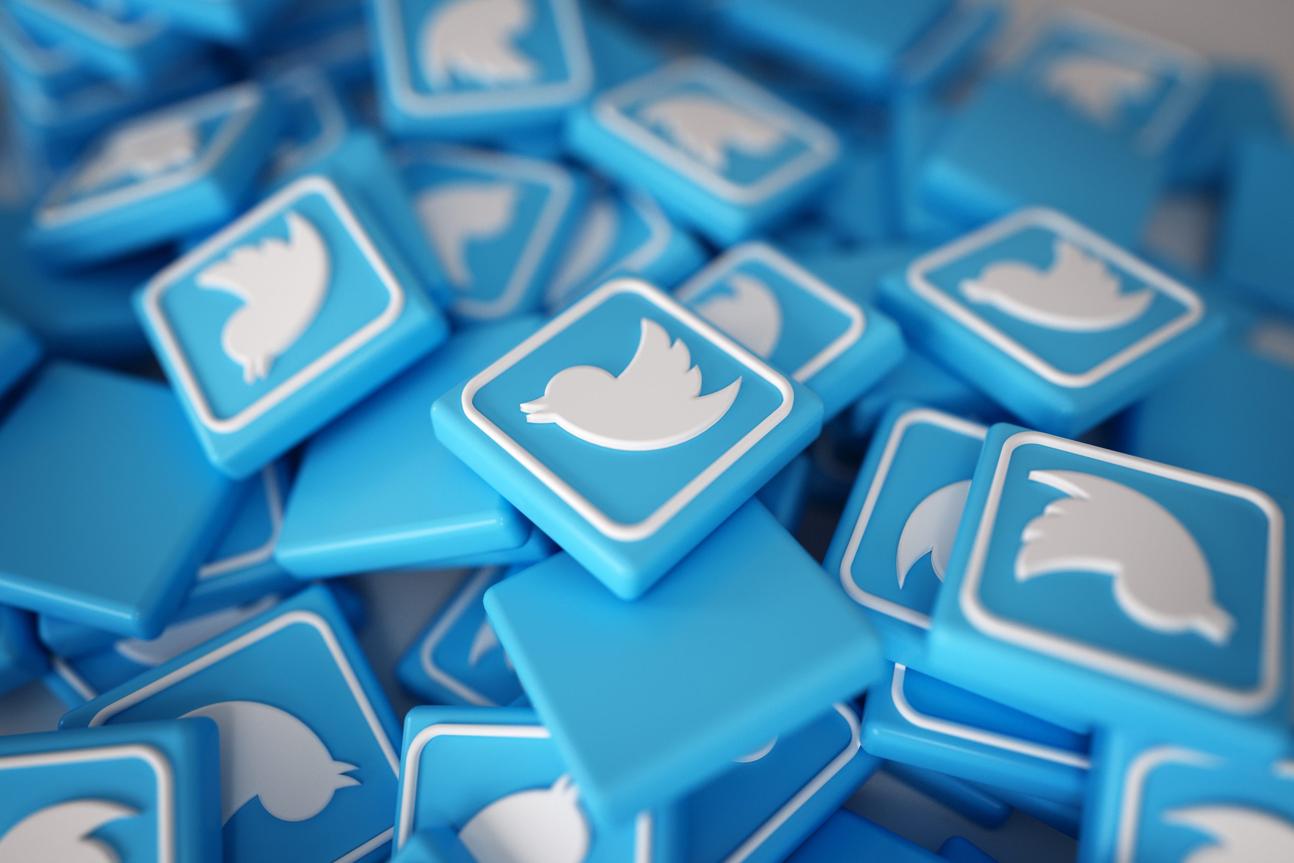 Twitter logos in a pile