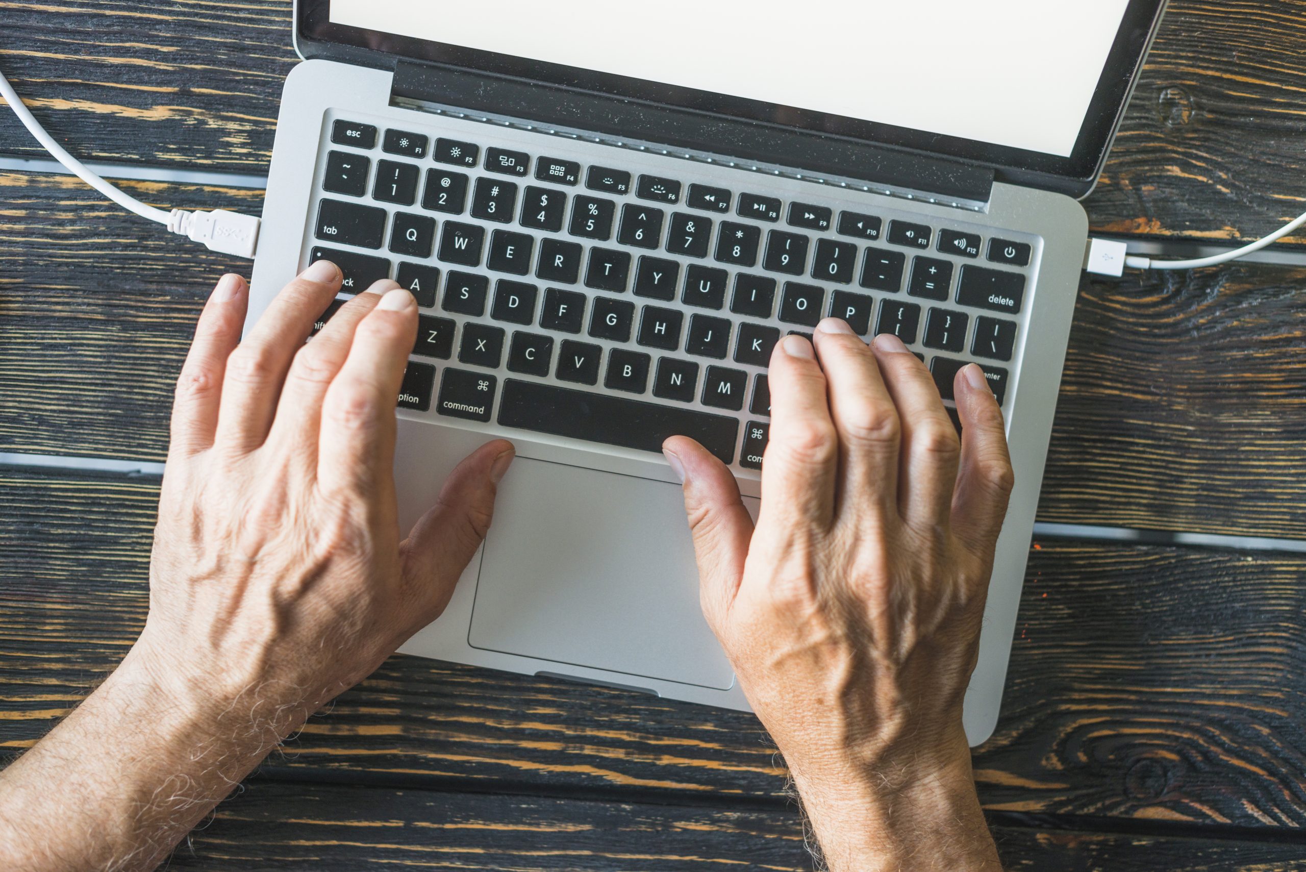 Person typing on laptop