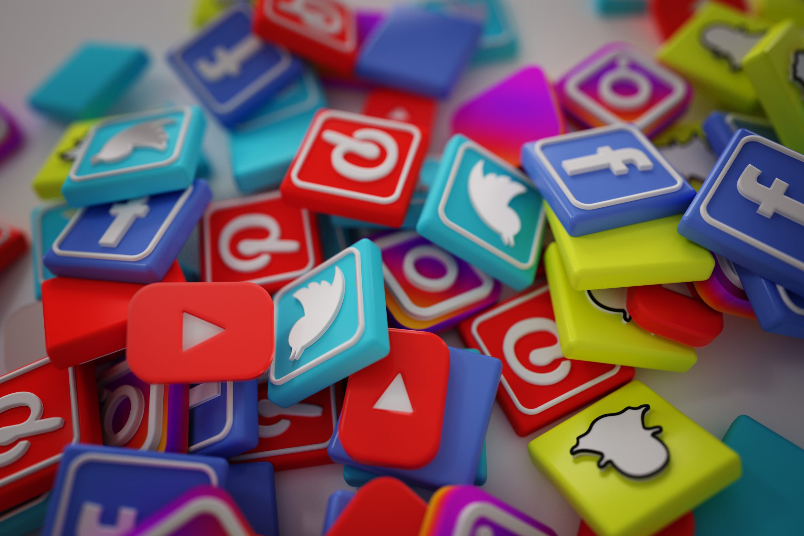 Pile of Twitter, YouTube, Facebook, Pinterest and Snapchat logos
