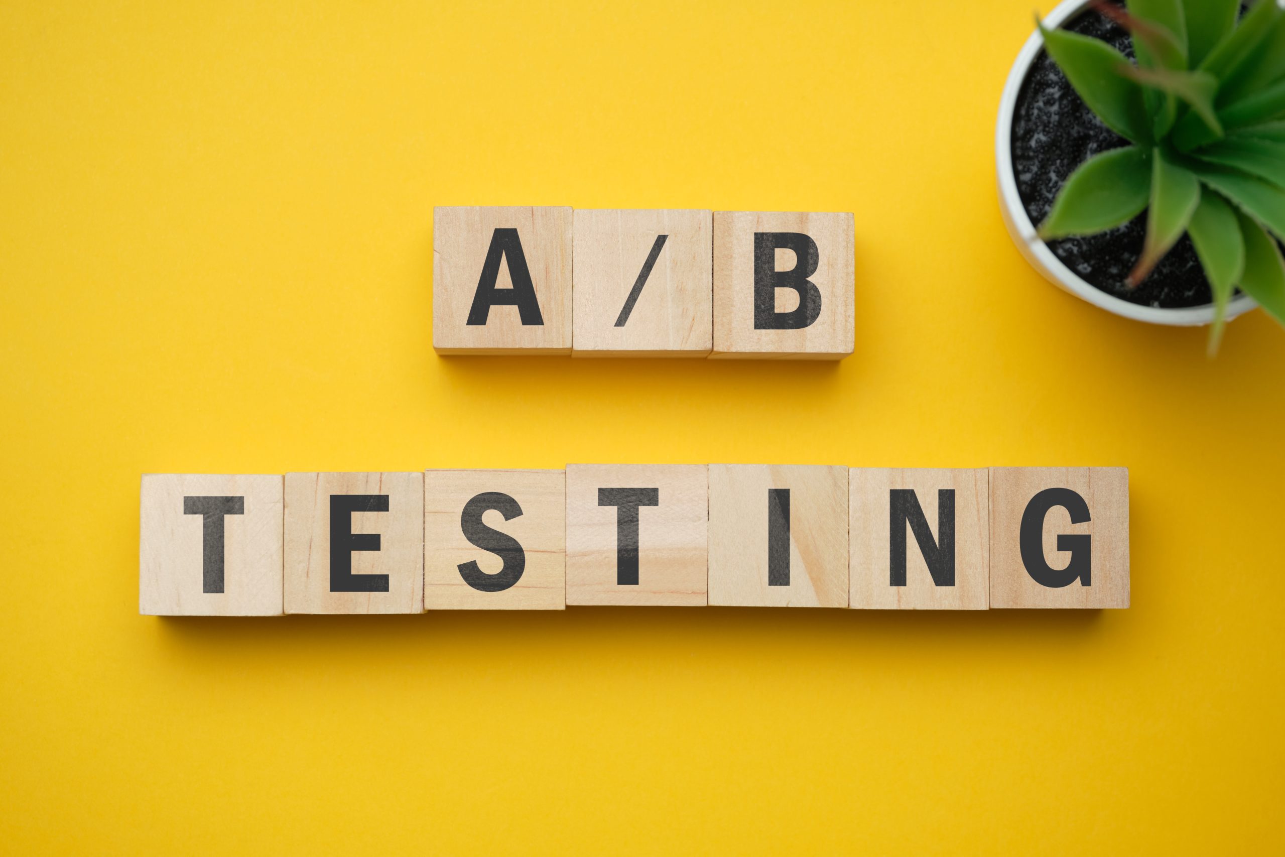 A/B TESTING spelt out on wooden blocks on a wooden table 