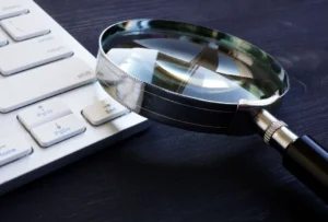 magnifying glass and keyboard