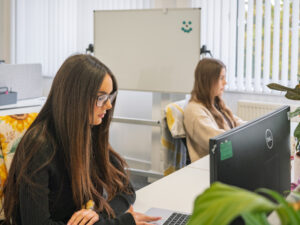 Two women working at computers